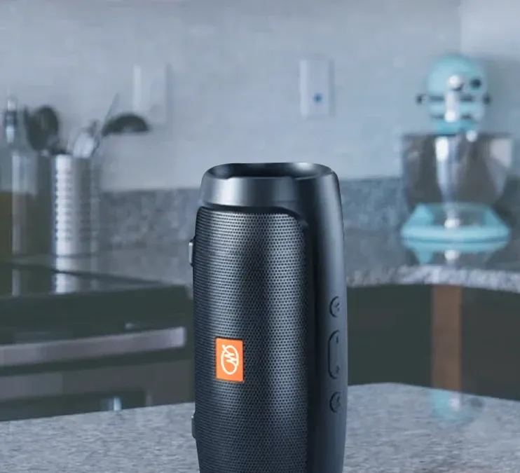 WallaSound speaker playing on a kitchen counter