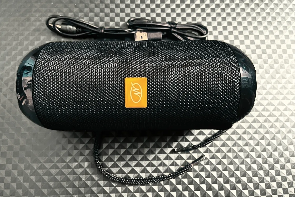 WallaSound speaker beside its USB charging cable